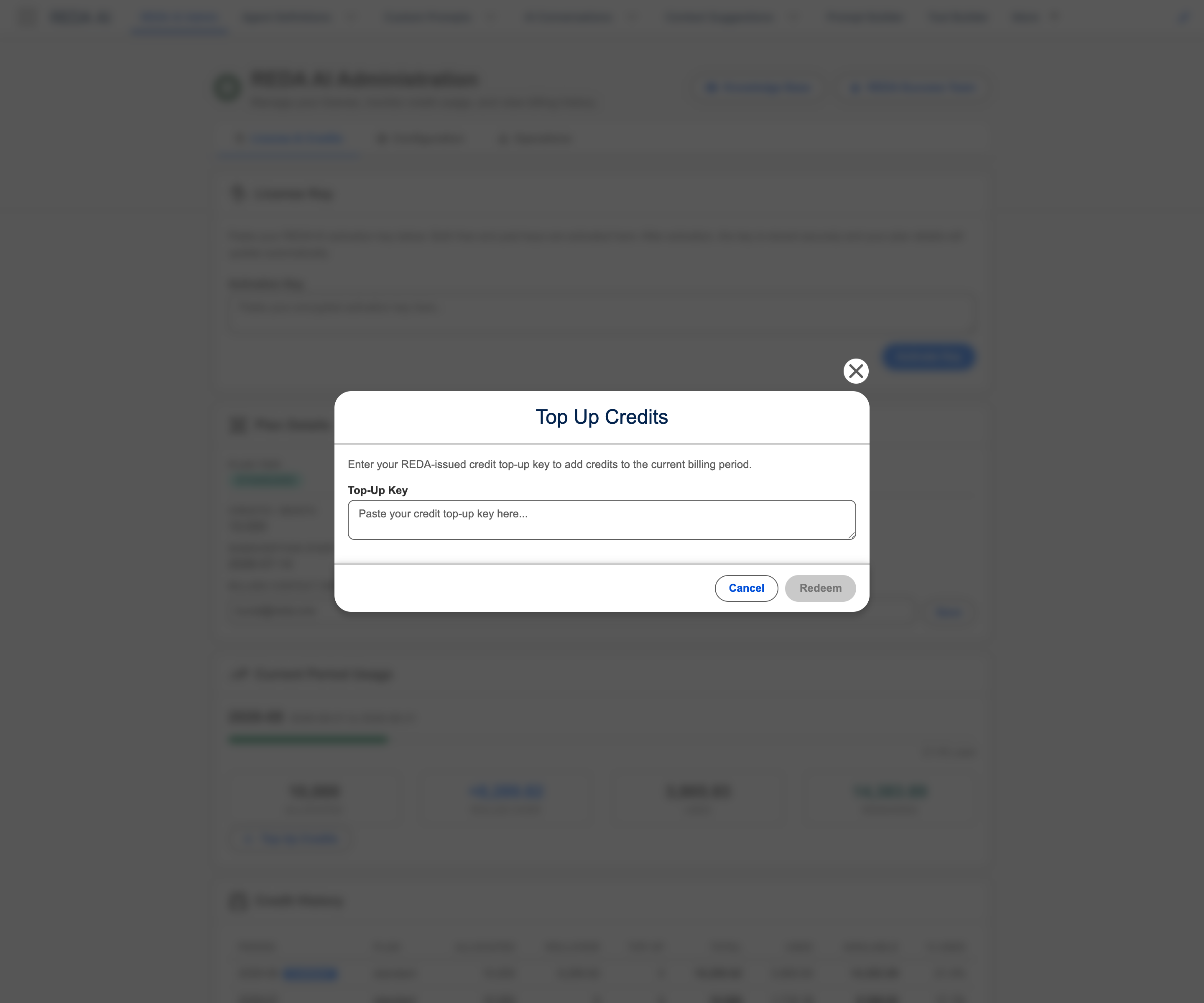 The Top Up Credits dialog open over the REDA AI Administration tab. The dialog explains that you enter your REDA-issued credit top-up key to add credits to the current billing period. A Top-Up Key textarea shows the placeholder 'Paste your credit top-up key here...', with Cancel and Redeem buttons at the bottom right; Redeem is greyed out until a key is entered. The Administration tab is dimmed behind the dialog.